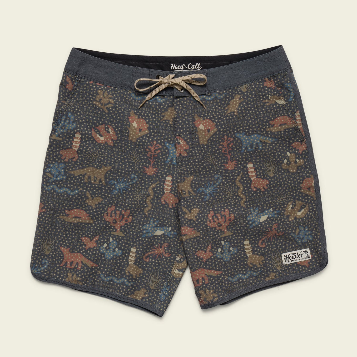 Patterned Bruja Boardshorts with a drawstring waist, featuring colorful dinosaurs and plants on a dark background with scattered dots. Stretchy fabric and draining front pockets add comfort and function. A Howler Bros patch is sewn near the bottom hem.