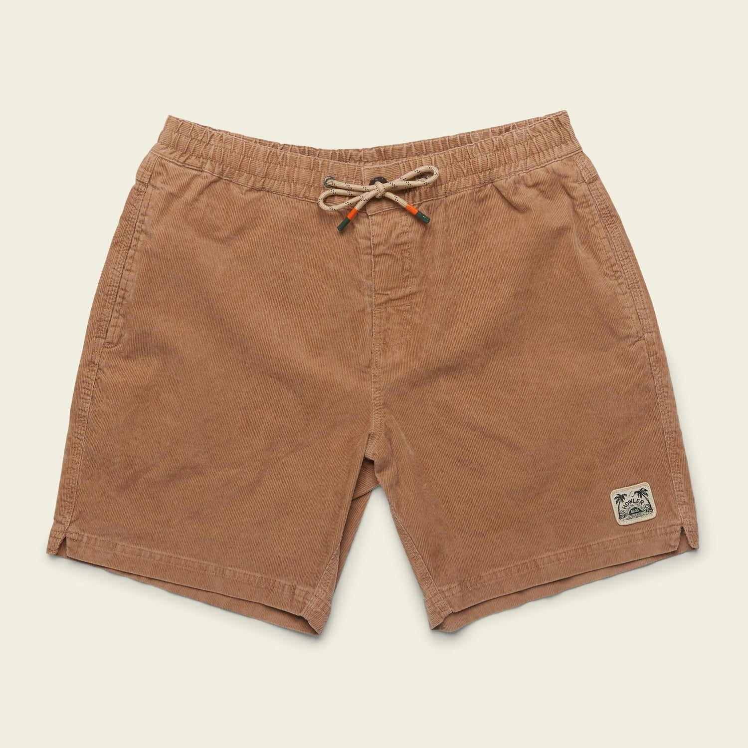 Brown stretch cotton corduroy shorts with an elastic waistband, drawstring, side pockets, and a small palm tree logo patch on the left leg—Pressure Drop Cord Shorts designed for all day comfort.