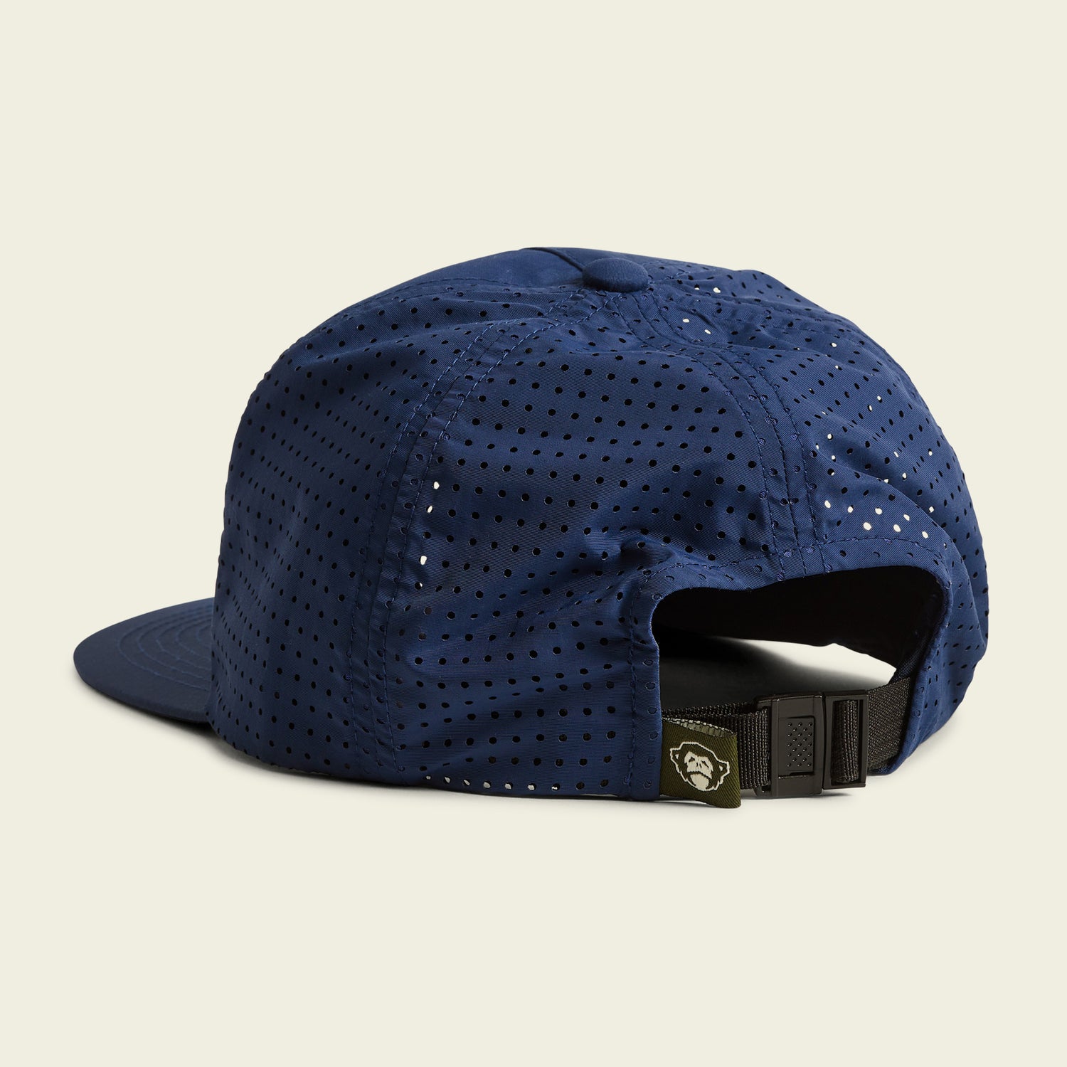 A blue perforated baseball cap designed as a breathable tech hat with an adjustable black strap and buckle at the back, perfect for outdoor adventures. Displayed against a plain light background. - View 3