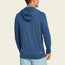 A man wearing a long-sleeve blue UPF 50+ lightweight hoodie and light blue shorts stands facing away from the camera against a plain background.